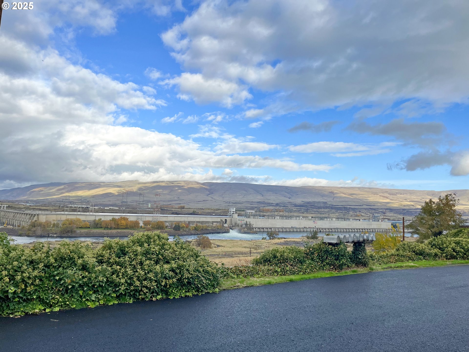 3564 East 2nd Street, Unit 33 The Dalles, OR 97058 - Photo 8 of 15 a view of a pathway both side of a lake view