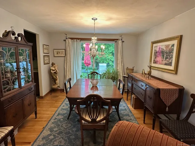 a view of a dining room with furniture window and outside view