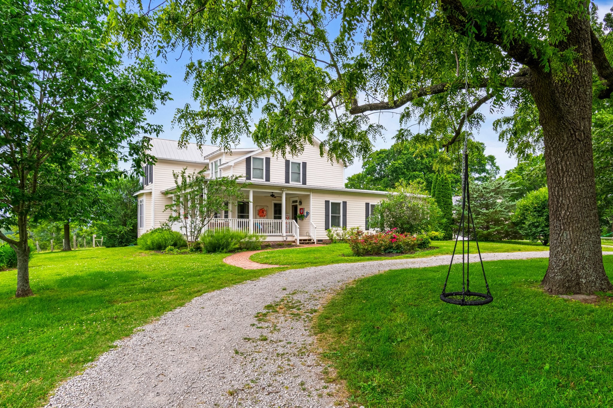 4540 Peytonsville Road Franklin, TN 37064 - Photo 37 of 84 a view of a house next to a yard with big trees