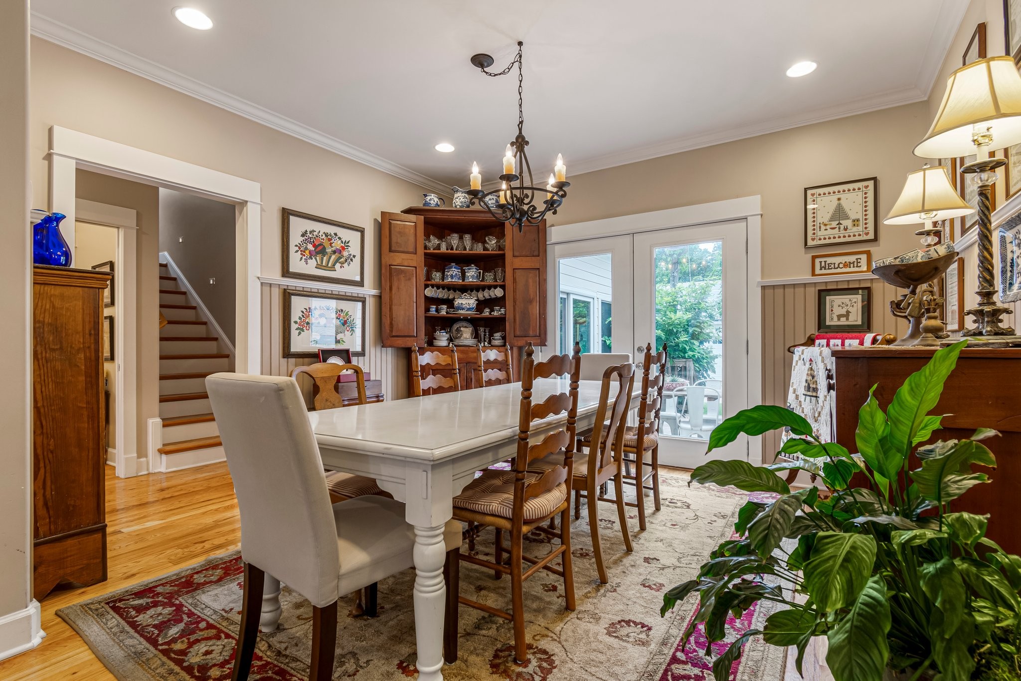 4540 Peytonsville Road Franklin, TN 37064 - Photo 55 of 84 a dining room with furniture potted plants and wooden floor