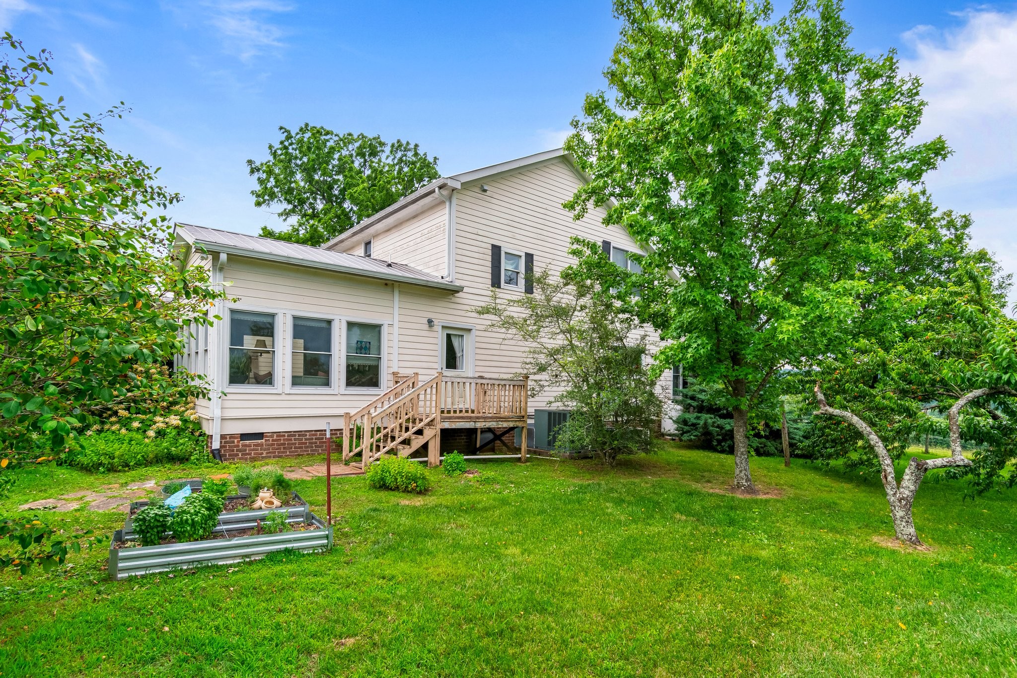4540 Peytonsville Road Franklin, TN 37064 - Photo 70 of 84 a view of a house with a backyard and a patio