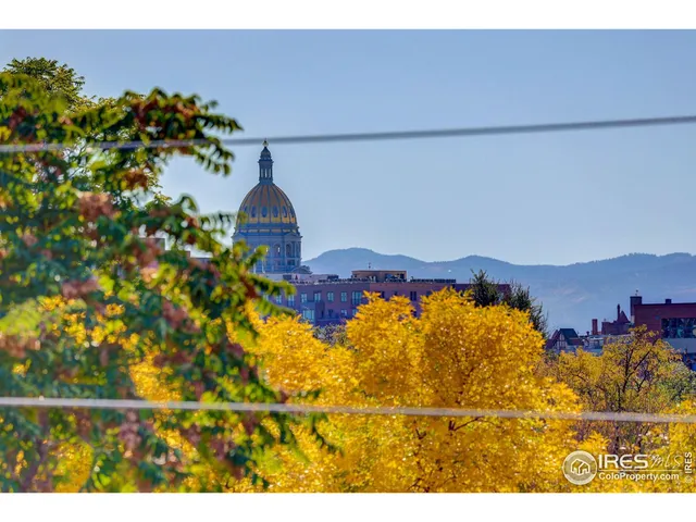 a view of a house with a yard and a mountain
