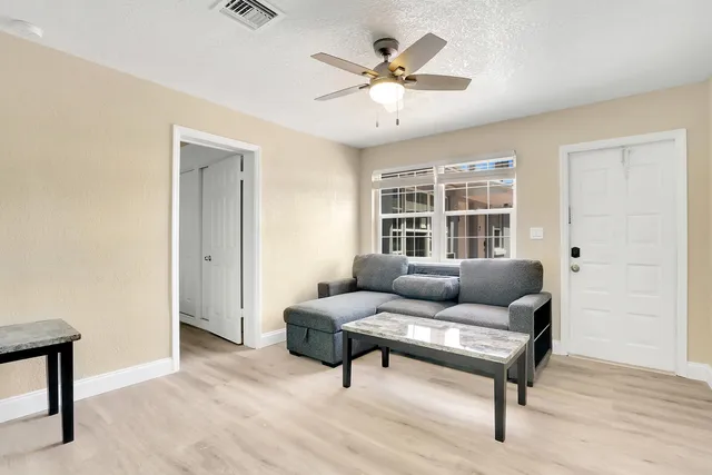 a living room with furniture and a window