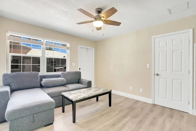 a living room with furniture and a window