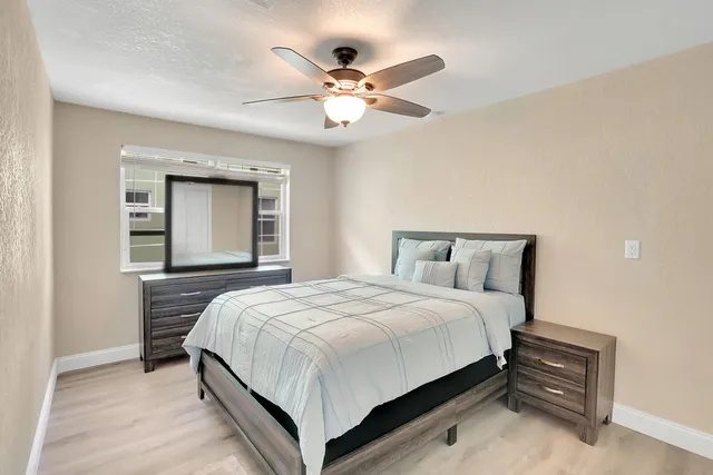 a bedroom with a bed and window