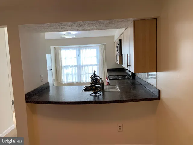 a view of kitchen island with wooden floor