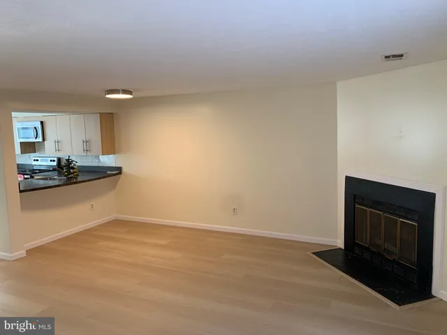 a view of a kitchen with a sink and a stove top oven