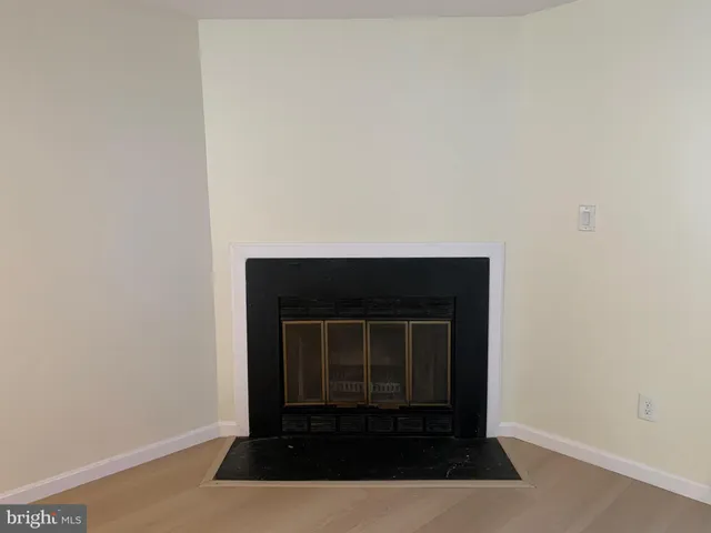 a fireplace with a hallway