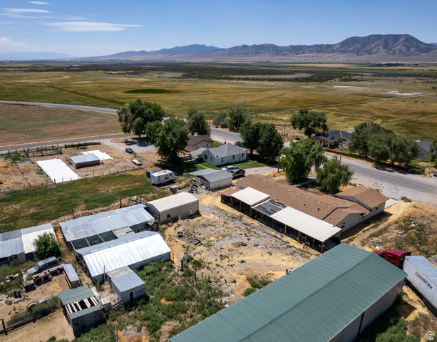 445 South Main Street Fayette, UT 84630 - Photo 10 of 45 Aerial view of sparsely populated area featuring a mountain backdrop and nearby suburban area