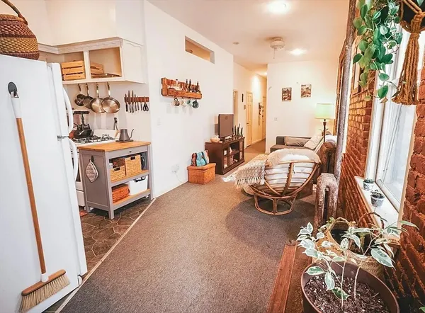 a room with furniture and a chandelier