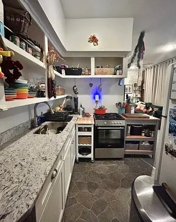 a kitchen with a stove and a cabinets