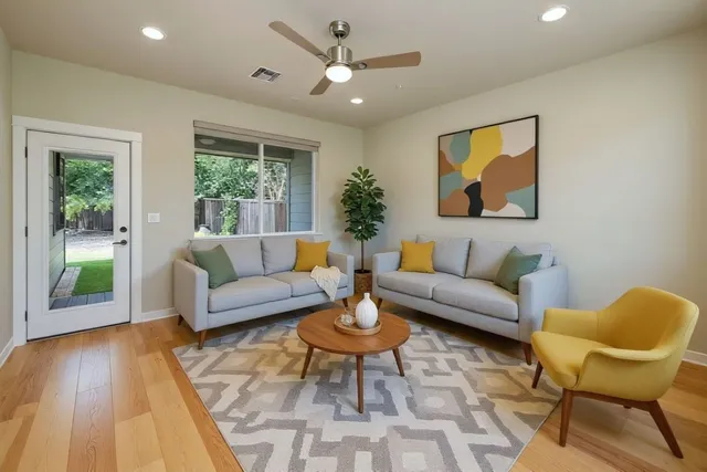 a living room with furniture and a large window