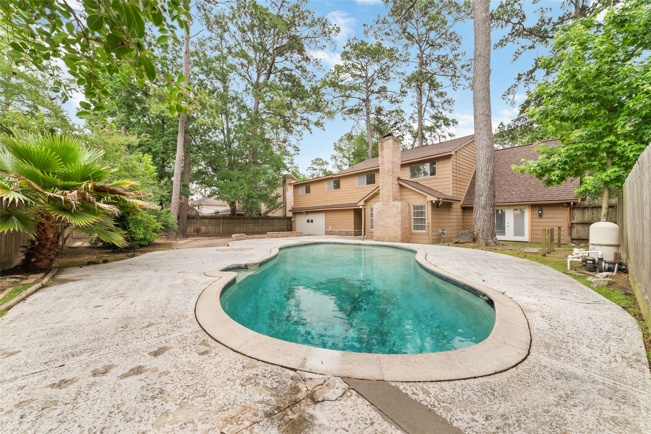 7910 Oak Moss Drive Spring, TX 77379 - Photo 29 of 38 The backyard with pool is big enough for any family entertaining or gathering activities.