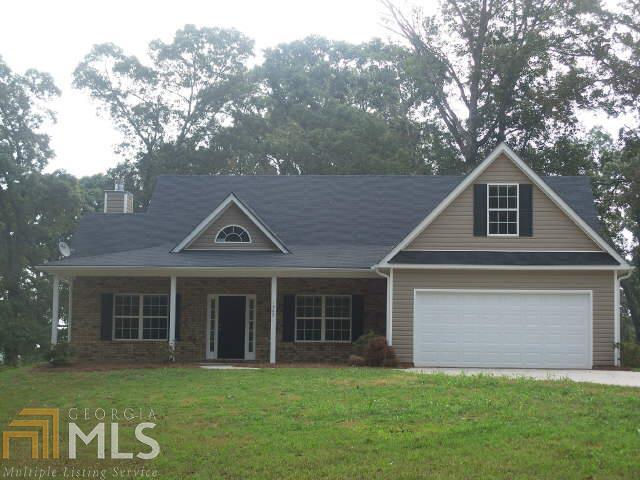 1562 Kilgore Road Griffin, GA 30223 - Photo 1 of 1 a front view of a house with a garden and yard