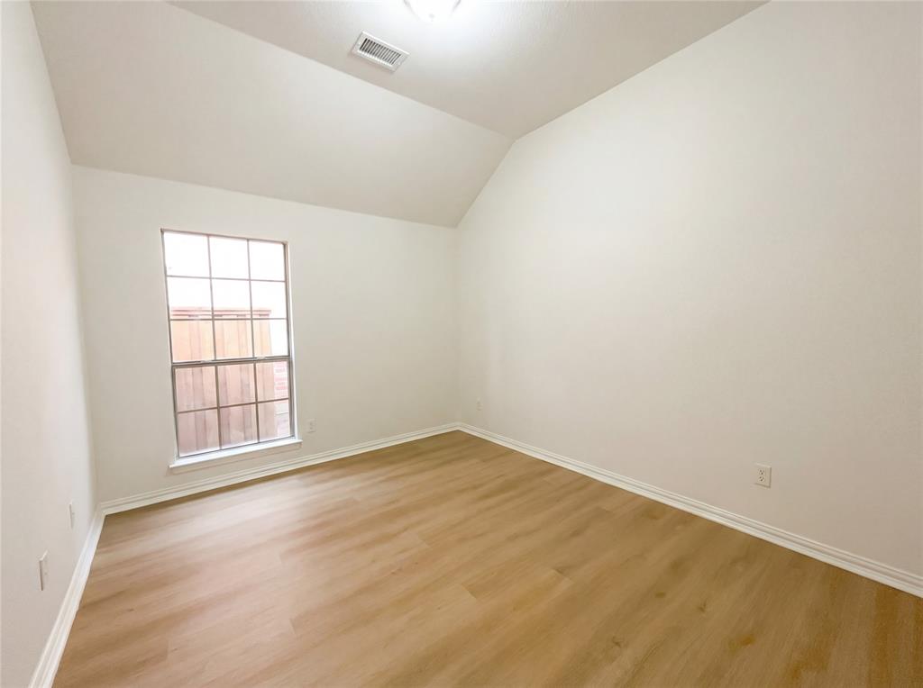 2128 Chambers Drive Allen, TX 75013 - Photo 15 of 23 an empty room with wooden floor and windows