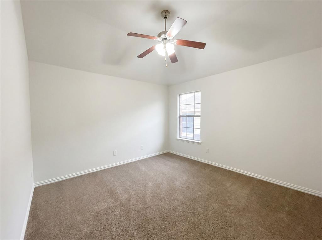 2128 Chambers Drive Allen, TX 75013 - Photo 19 of 23 an empty room with windows and fan