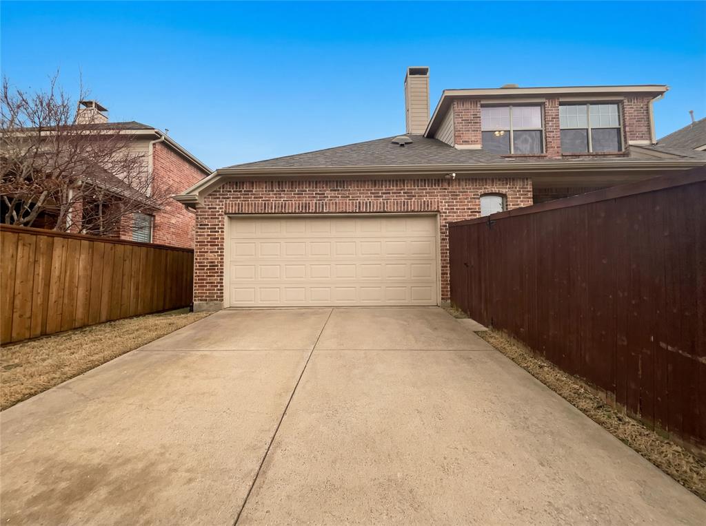 2128 Chambers Drive Allen, TX 75013 - Photo 20 of 23 a front view of a house with a garage