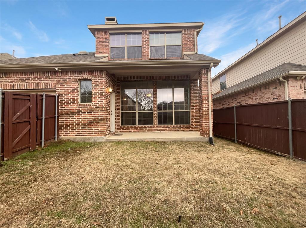 2128 Chambers Drive Allen, TX 75013 - Photo 5 of 23 a view of a house with a large window and wooden fence