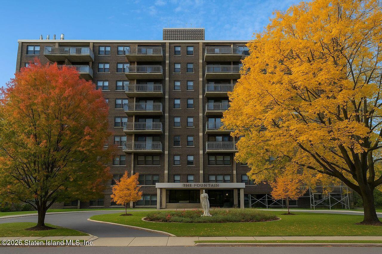 1100 Clove Road, Unit 5G Staten Island, NY 10301 - Photo 11 of 14 a view of a tall building next to a yard