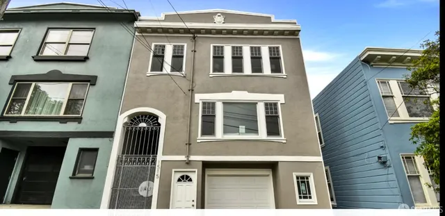 a front view of multi story residential apartment building