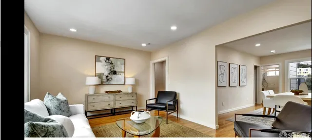 a living room with furniture and a table