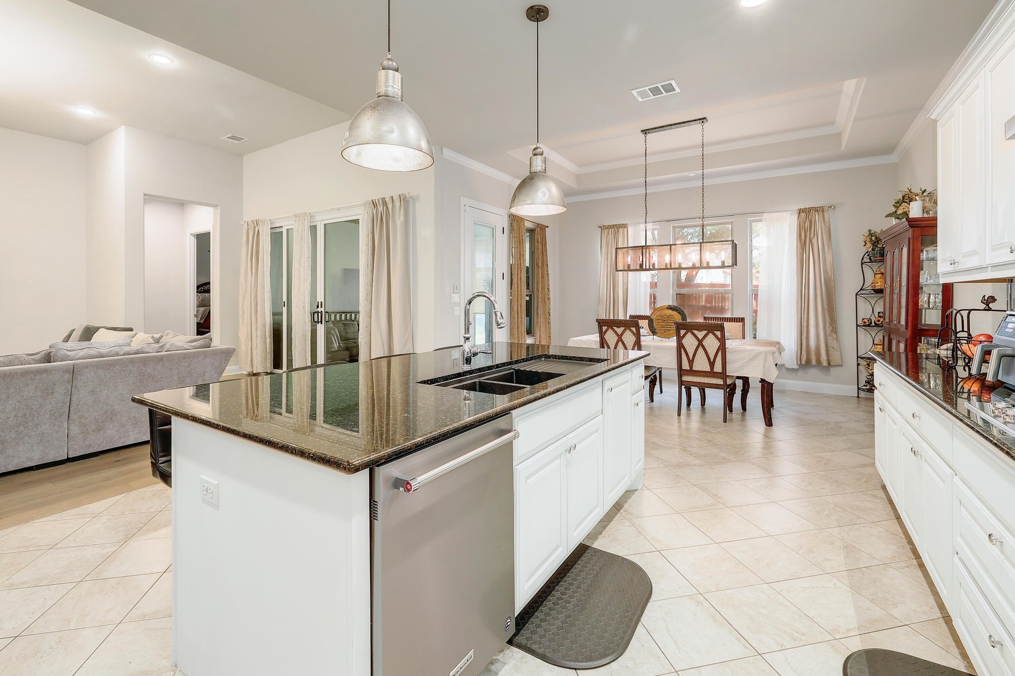 249 Axis Loop Georgetown, TX 78628 - Photo 12 of 36 a kitchen with granite countertop a sink a counter top space appliances and cabinets