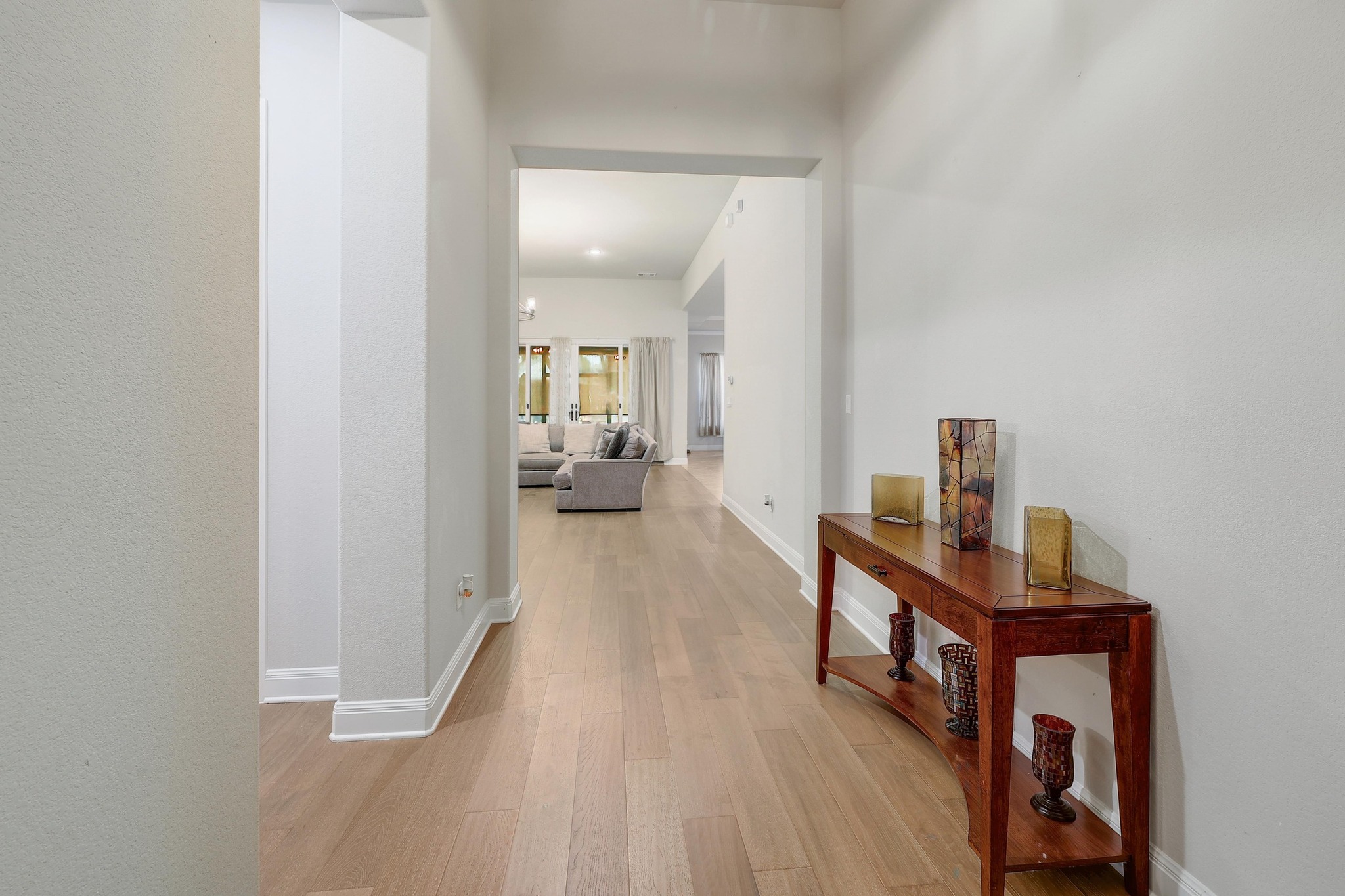 249 Axis Loop Georgetown, TX 78628 - Photo 14 of 36 Hall featuring light wood-style flooring and baseboards