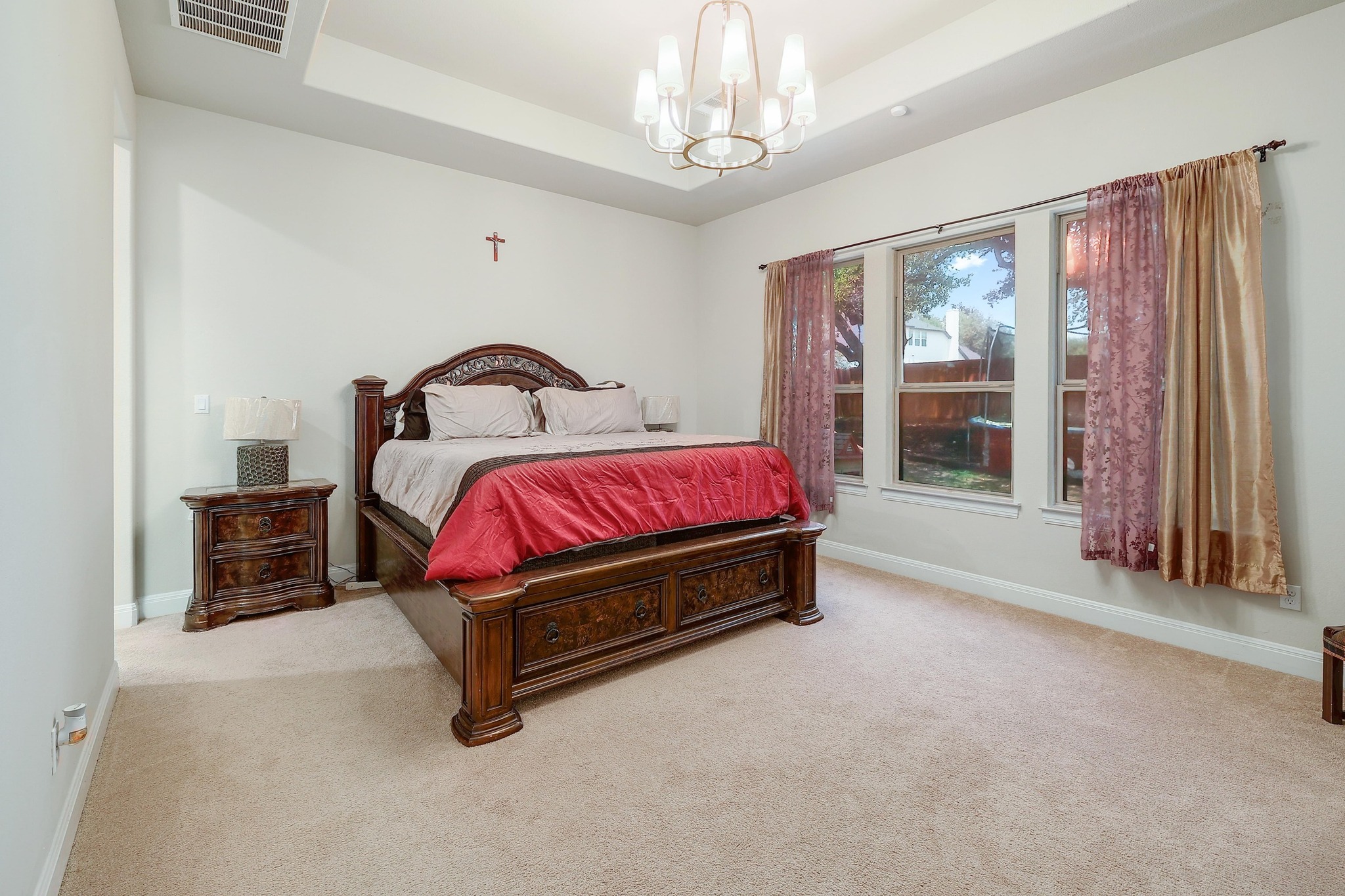249 Axis Loop Georgetown, TX 78628 - Photo 16 of 36 a spacious bedroom with a bed and a large window
