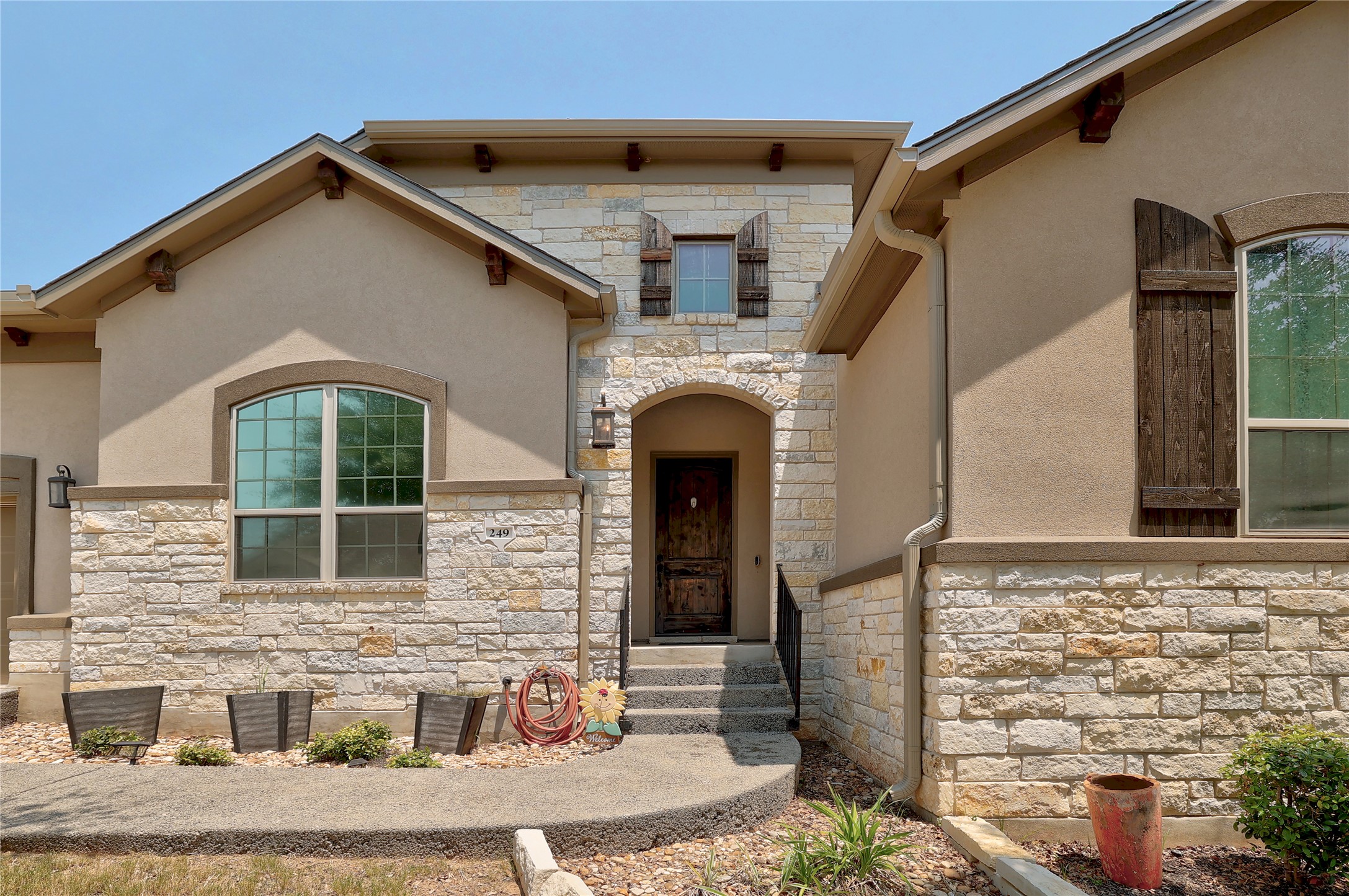 249 Axis Loop Georgetown, TX 78628 - Photo 2 of 36 a front view of a house with large windows