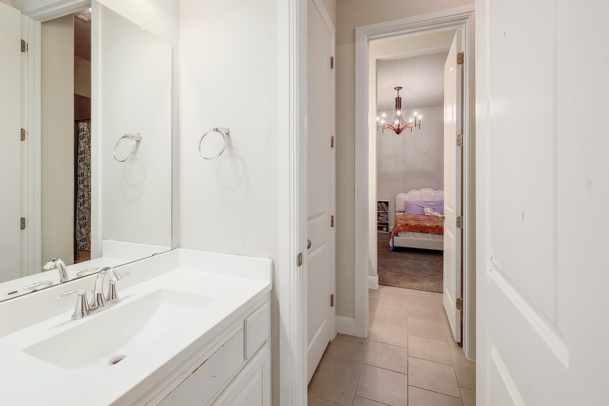 249 Axis Loop Georgetown, TX 78628 - Photo 25 of 36 a en suite bathroom with a sink and a mirror