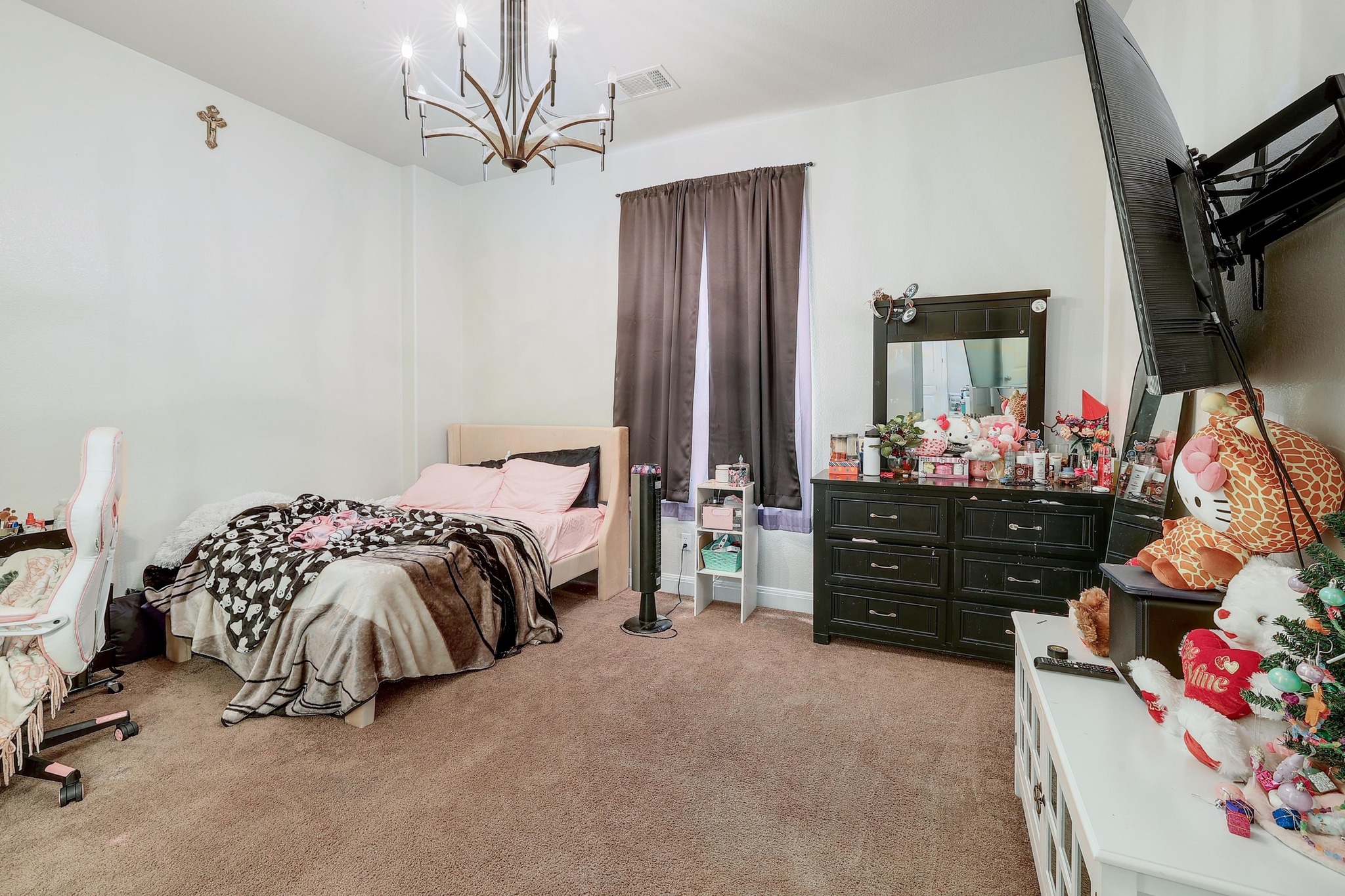 249 Axis Loop Georgetown, TX 78628 - Photo 26 of 36 a bedroom with a bed closet and flat tv screen