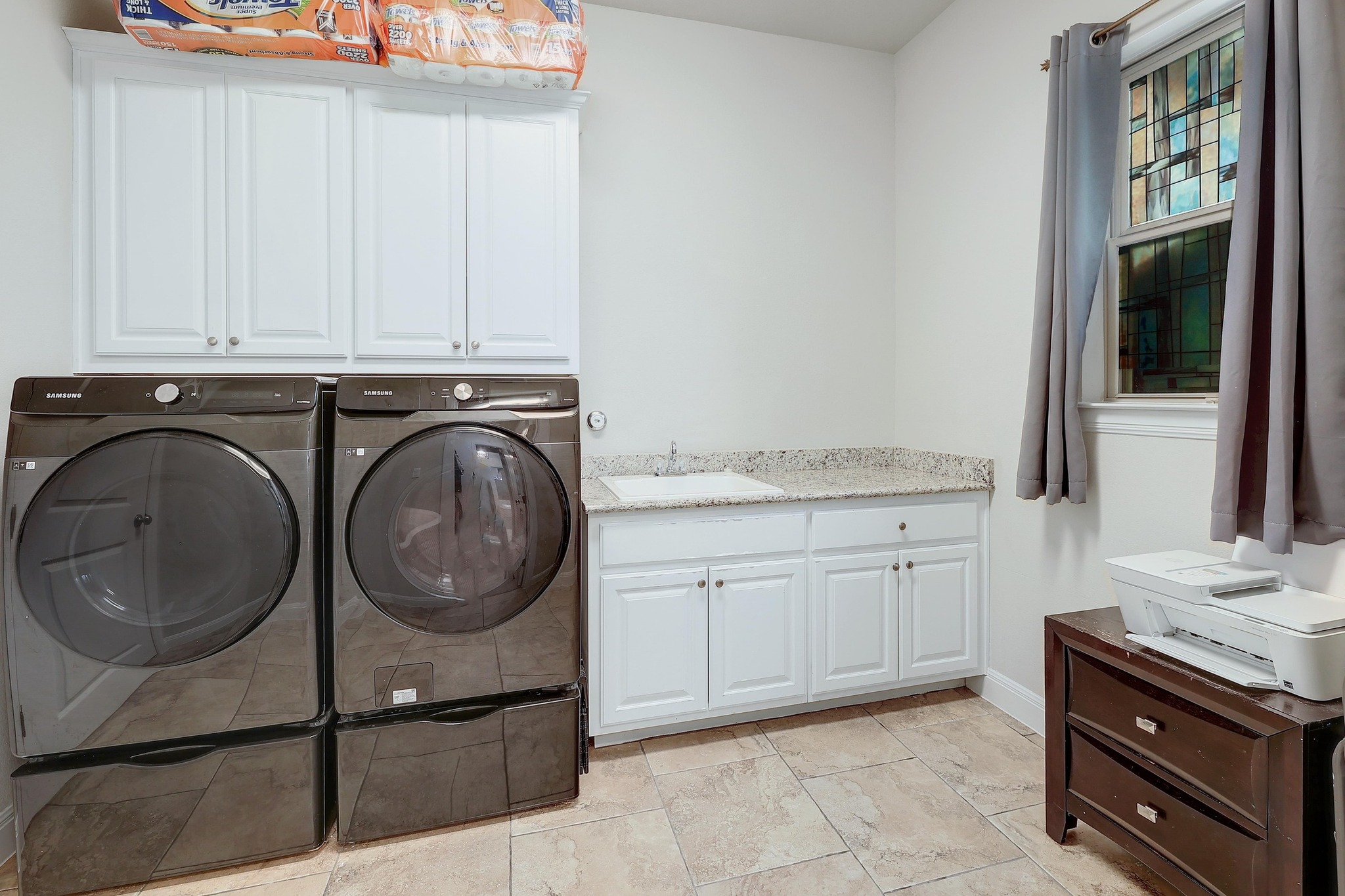 249 Axis Loop Georgetown, TX 78628 - Photo 29 of 36 a utility room with granite countertop a sink a washer and dryer