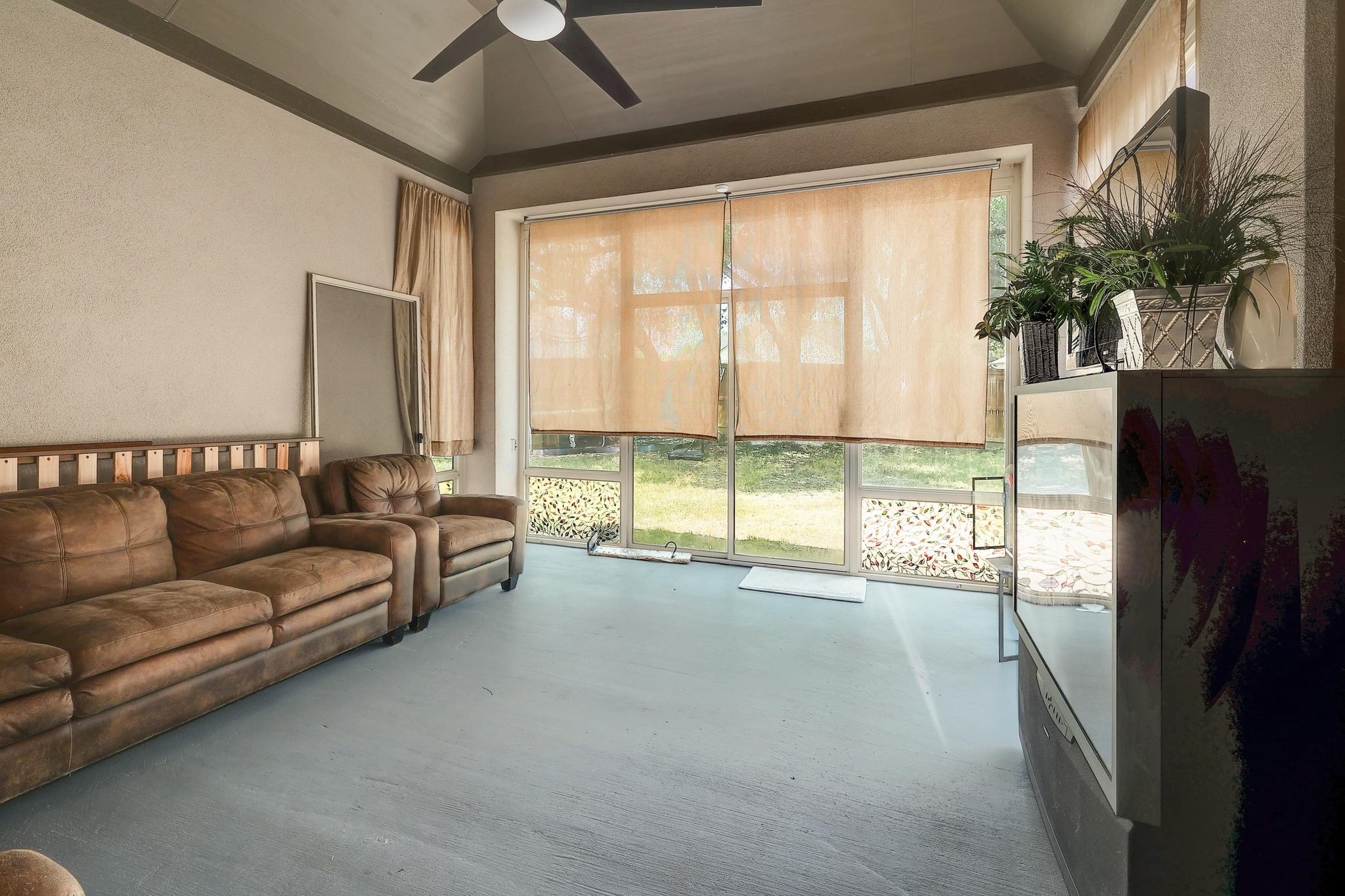249 Axis Loop Georgetown, TX 78628 - Photo 30 of 36 a living room with furniture and a large window with outer view