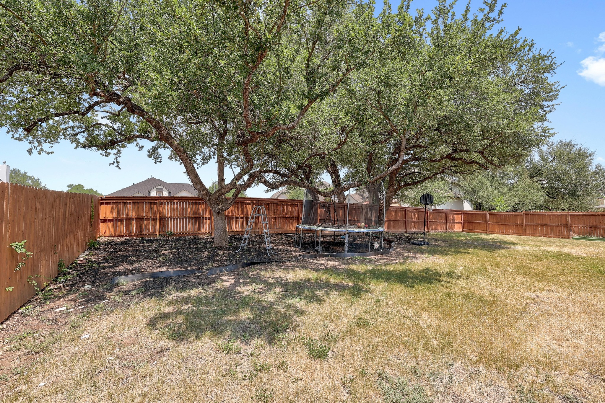 249 Axis Loop Georgetown, TX 78628 - Photo 32 of 36 a view of a house with a yard and sitting area