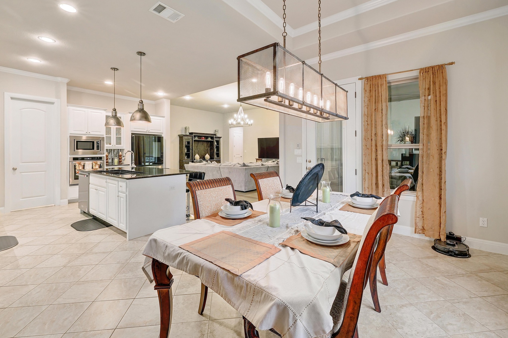 249 Axis Loop Georgetown, TX 78628 - Photo 7 of 36 a dining room with stainless steel appliances kitchen island granite countertop a dining table chairs and granite counter tops