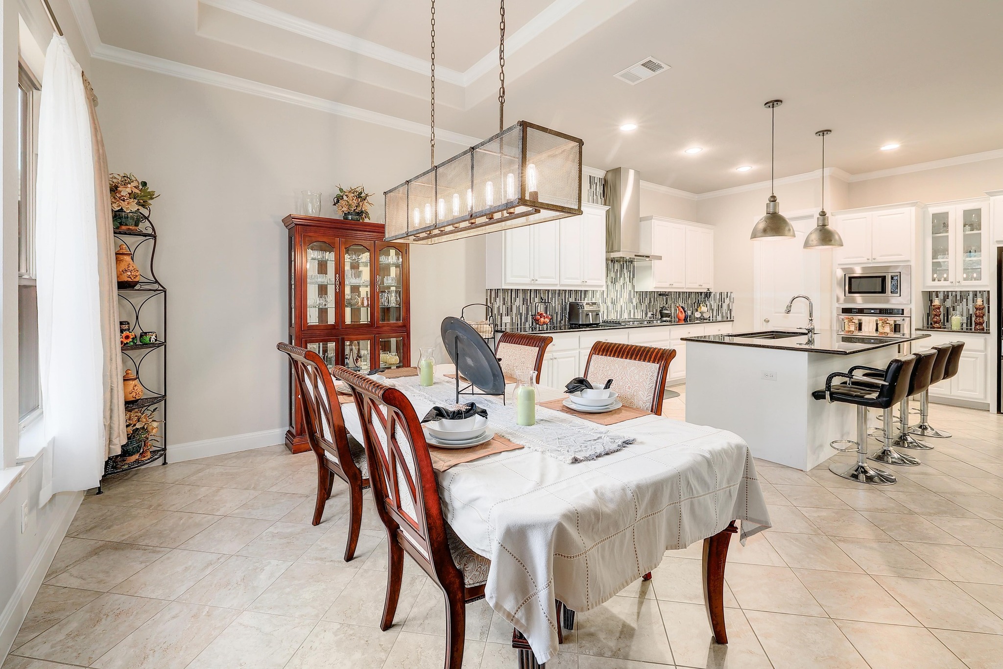 249 Axis Loop Georgetown, TX 78628 - Photo 8 of 36 a dining area with furniture and a chandelier