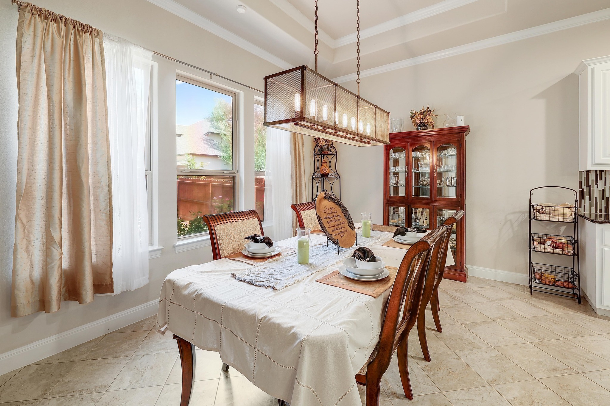 249 Axis Loop Georgetown, TX 78628 - Photo 9 of 36 a dining room with furniture a chandelier and window