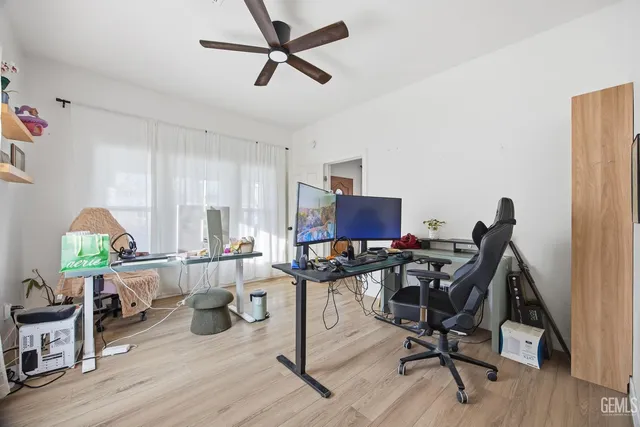 a workspace with furniture and a wooden floor