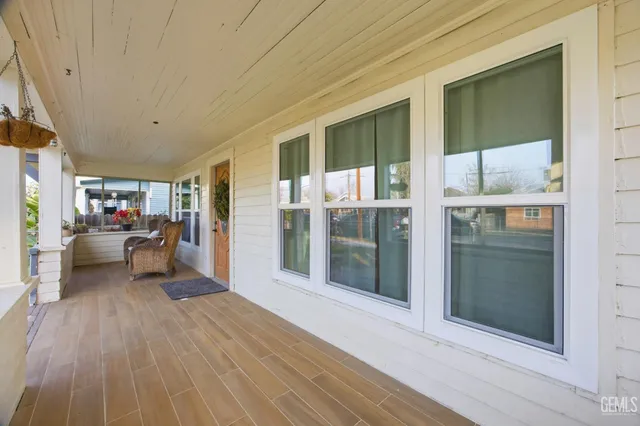 a view of a livingroom with furniture and hardwood floor