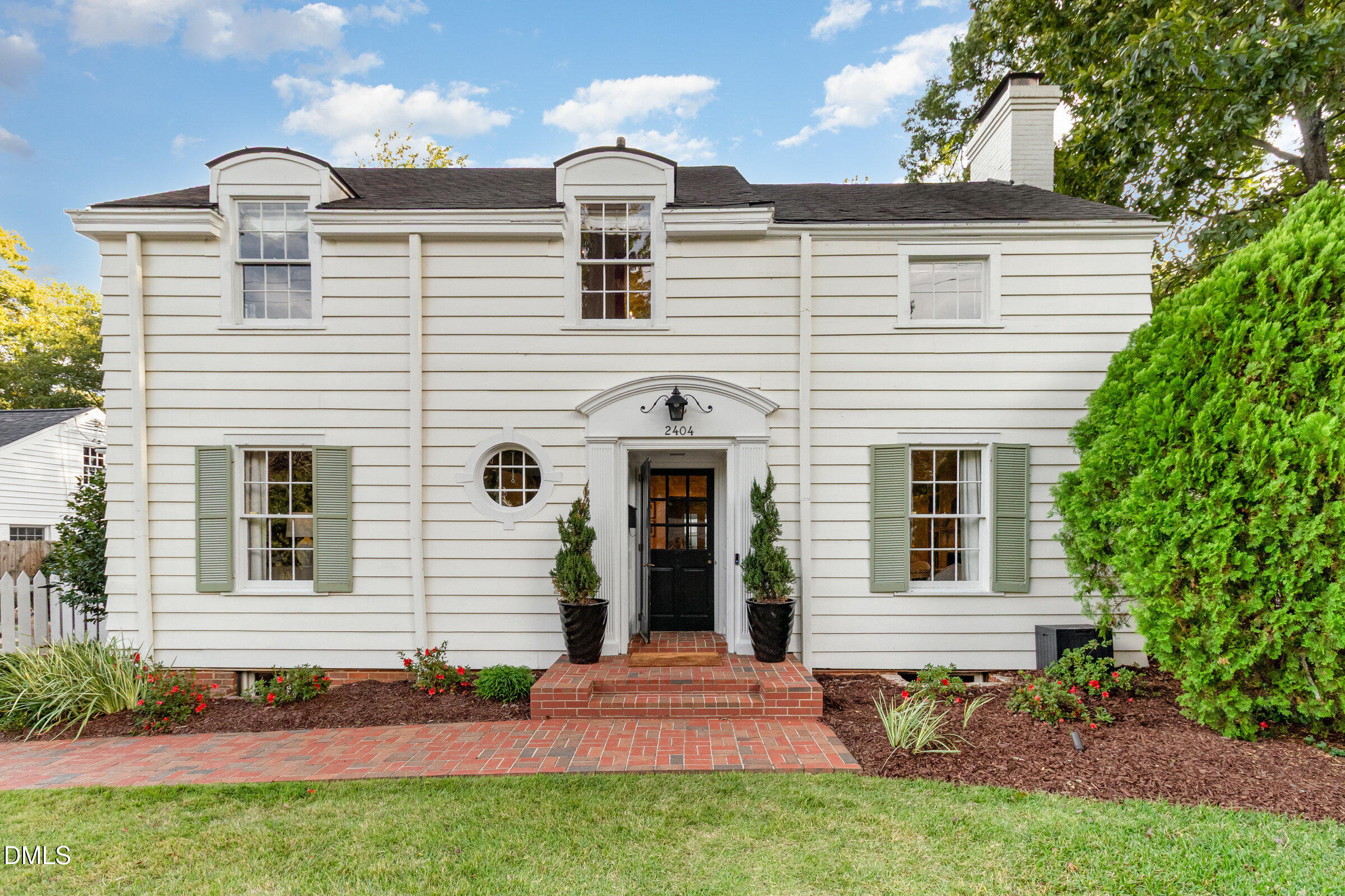 2404 Beechridge Road Raleigh, NC 27608 - Photo 1 of 52 a front view of a house with a yard