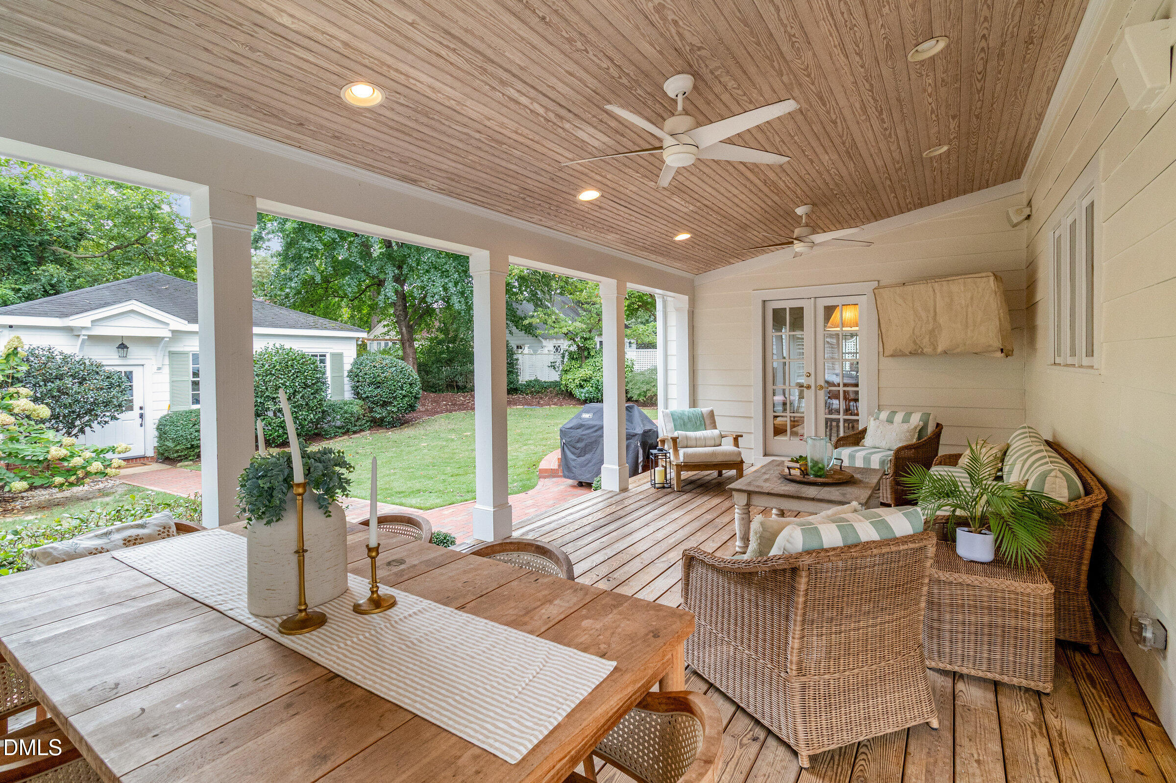 2404 Beechridge Road Raleigh, NC 27608 - Photo 7 of 52 a view of a patio with dining table and chairs