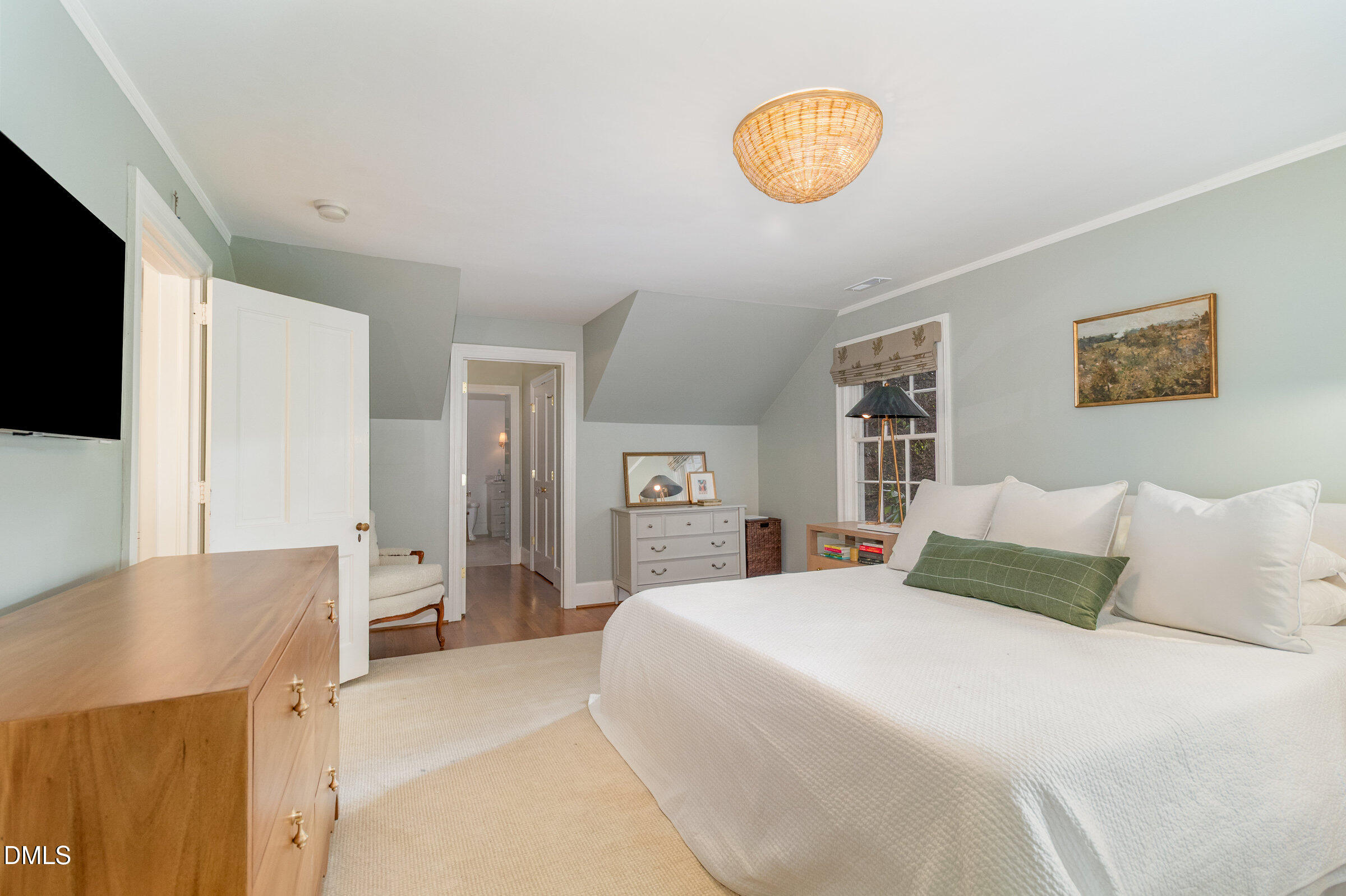 2404 Beechridge Road Raleigh, NC 27608 - Photo 22 of 52 a bedroom with a bed and a television