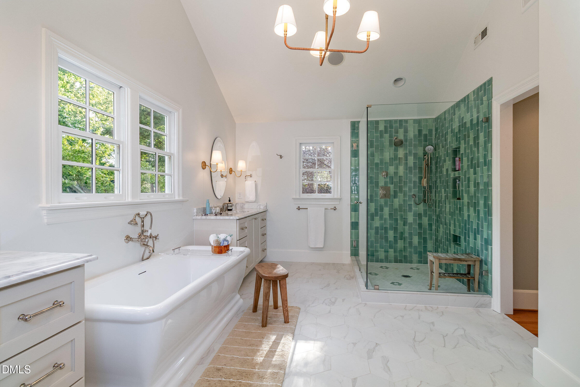 2404 Beechridge Road Raleigh, NC 27608 - Photo 25 of 52 a en suite spacious bathroom with a double vanity sink a mirror and a shower