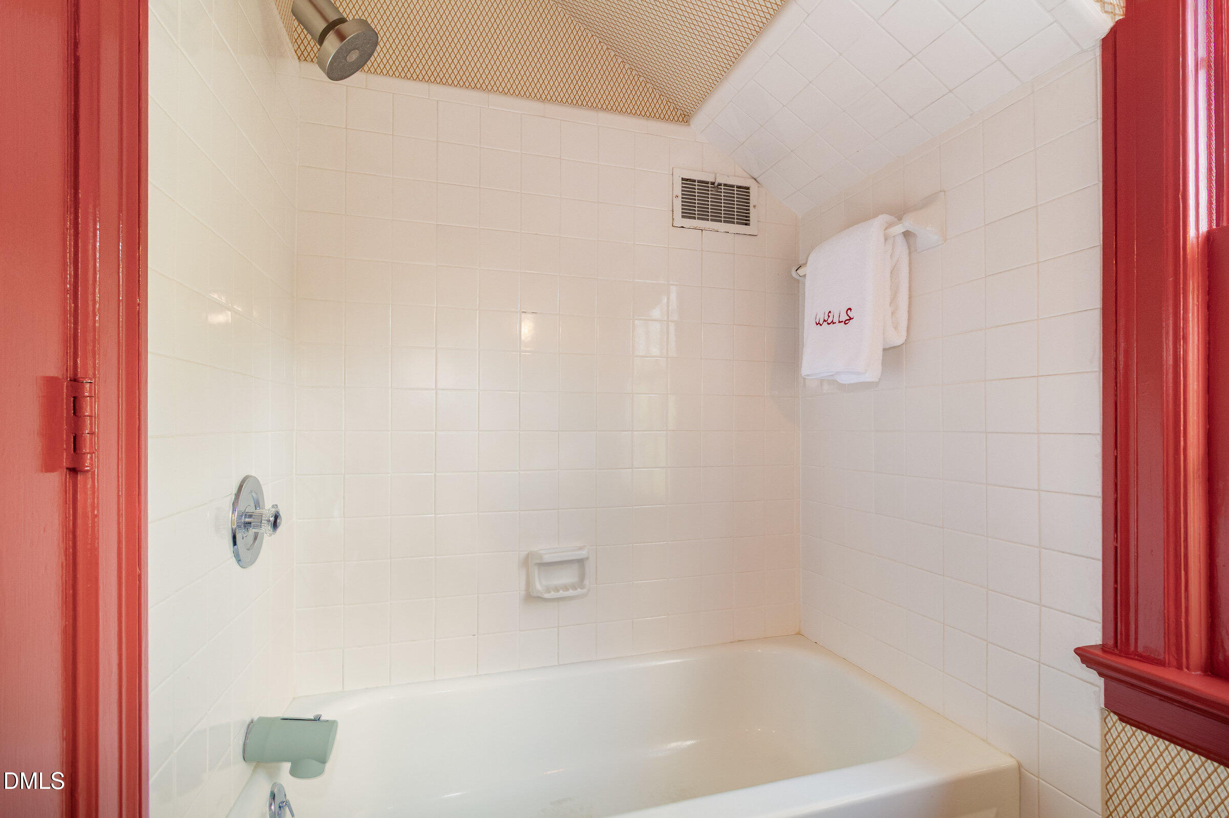 2404 Beechridge Road Raleigh, NC 27608 - Photo 33 of 52 a bath tub sitting next to a white sink