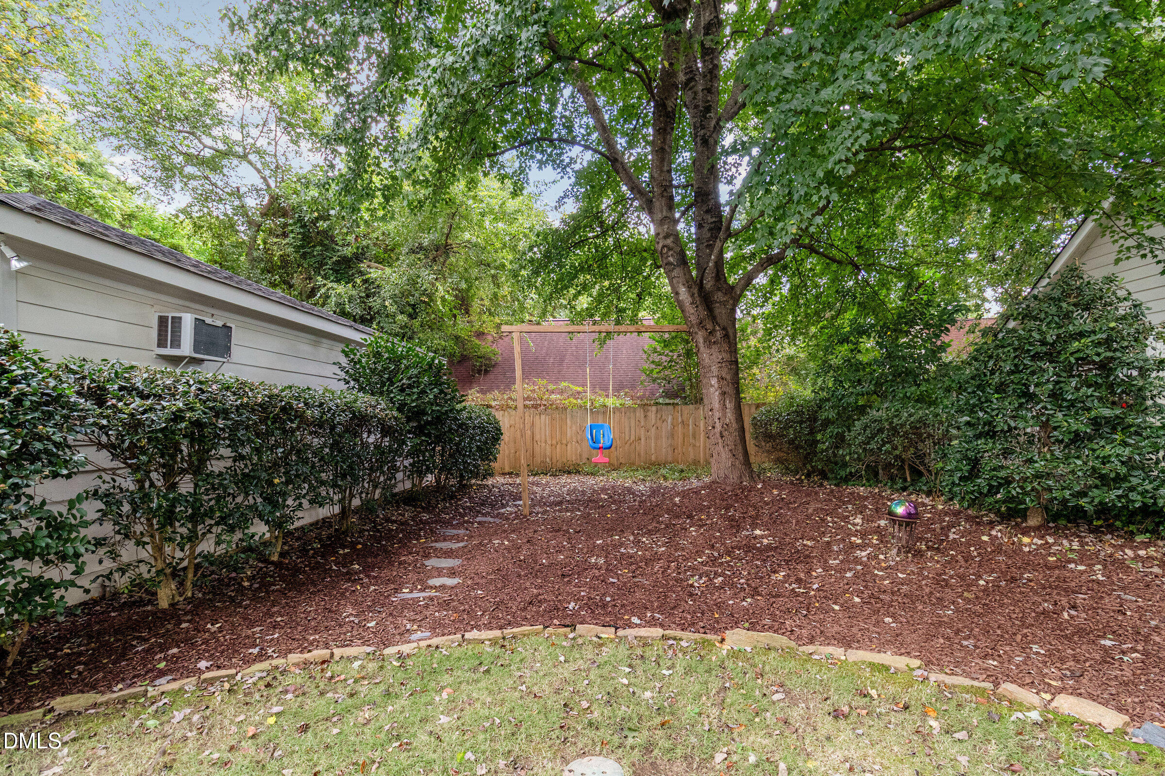 2404 Beechridge Road Raleigh, NC 27608 - Photo 46 of 52 a backyard of a house with lots of green space