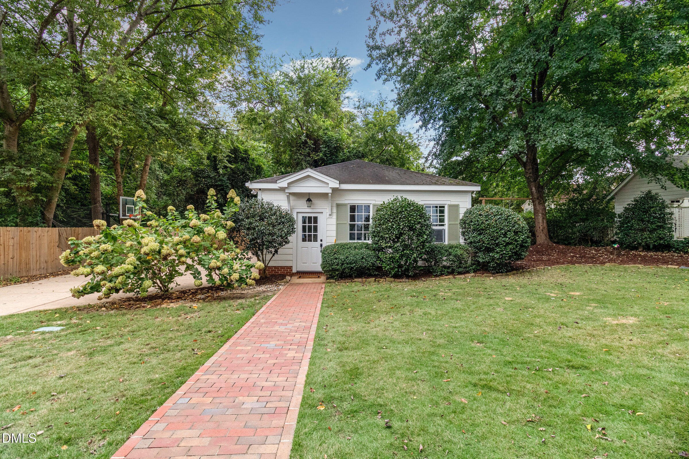 2404 Beechridge Road Raleigh, NC 27608 - Photo 47 of 52 a front view of a house with a yard