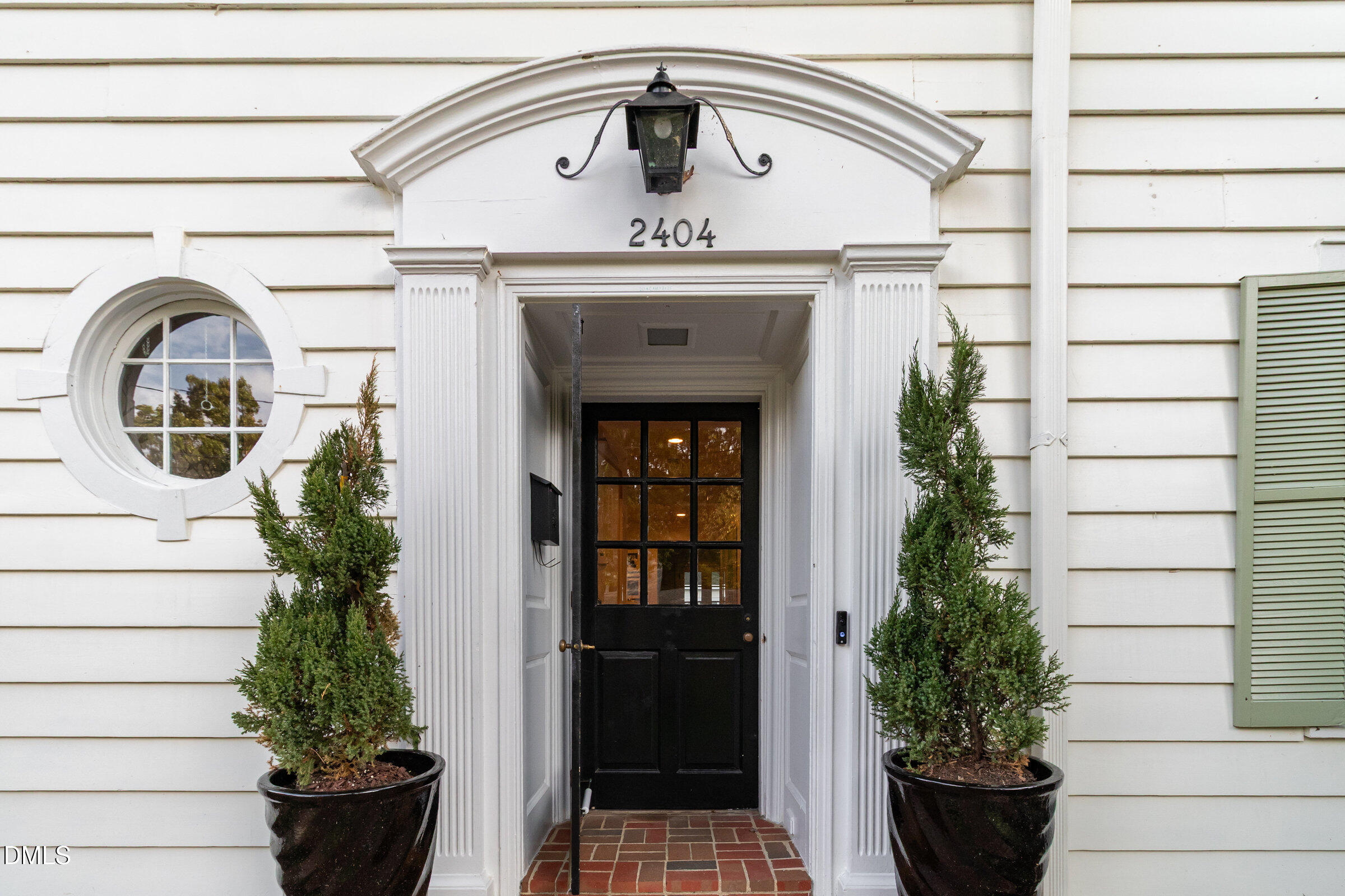 2404 Beechridge Road Raleigh, NC 27608 - Photo 5 of 52 a view of a entryway door of the house