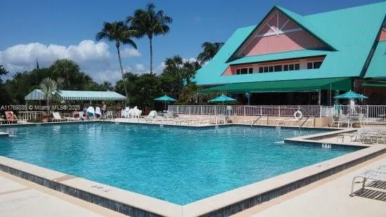a view of swimming pool from a balcony