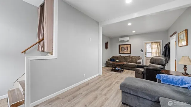 a living room with furniture and a window