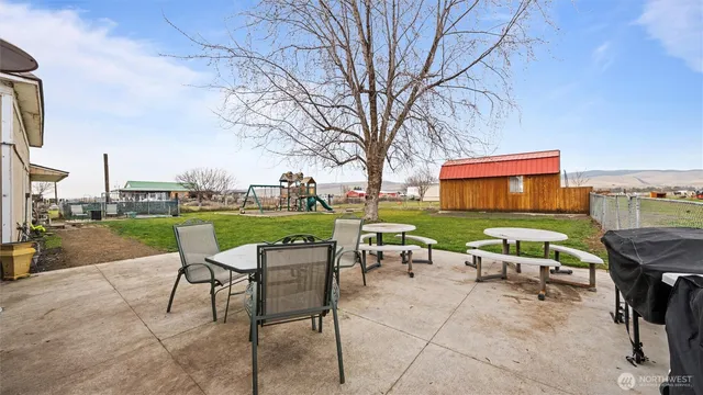 a yard with table and chairs